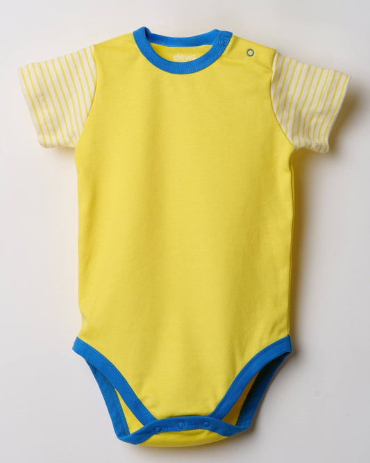 Baby wearing organic cotton bodysuit by Dew and Dove