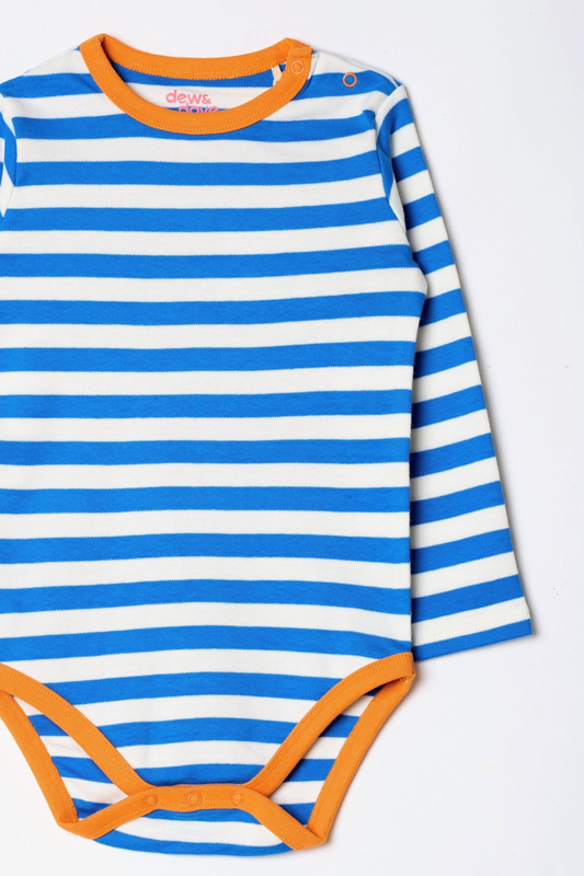 Baby in GOTS certified organic cotton clothing by Dew and Dove