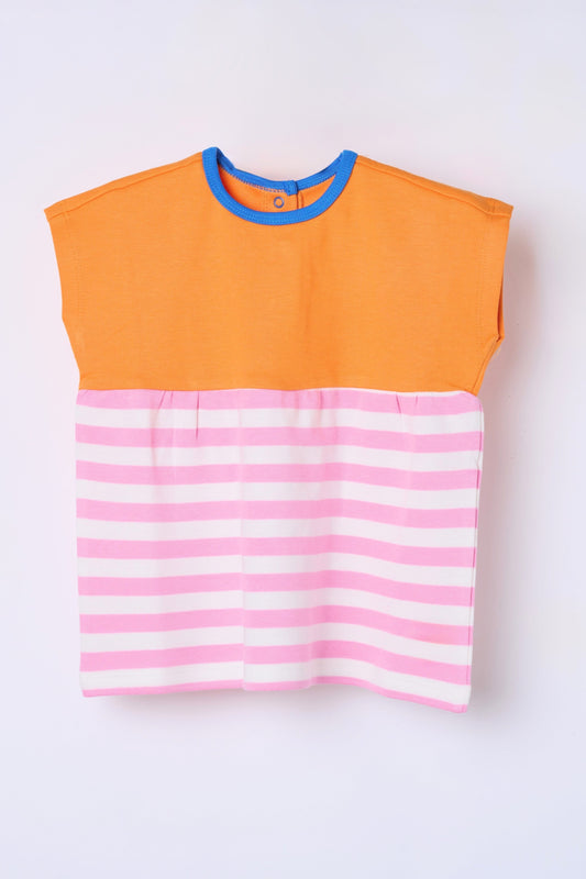 Child in organic cotton tunic Dew and Dove wardrobe essentials