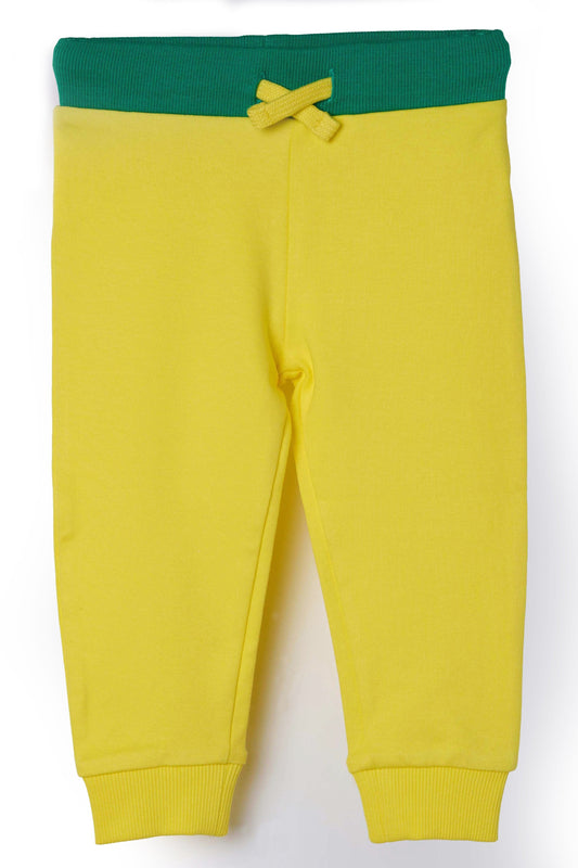 Child wearing organic cotton jogger pants by Dew and Dove
