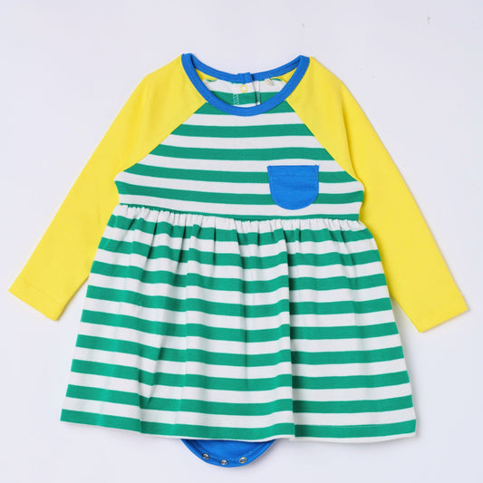 Baby girl in organic cotton bodysuit dress by Dew and Dove