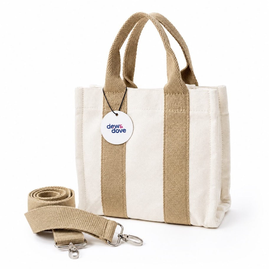 Dew & Dove cotton canvas tote bag with tan straps and detachable shoulder strap
