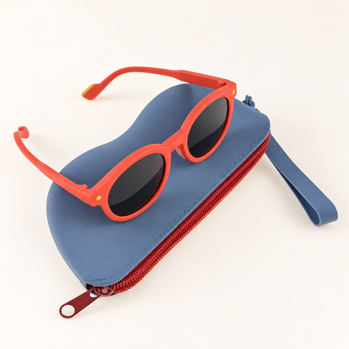 Orange kids round sunglasses with zip pouch